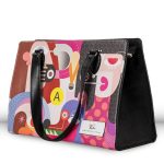 Gwyneth Lewin TekTote leather tote, Woman's Best Friend limited edition print, three-quarter side view